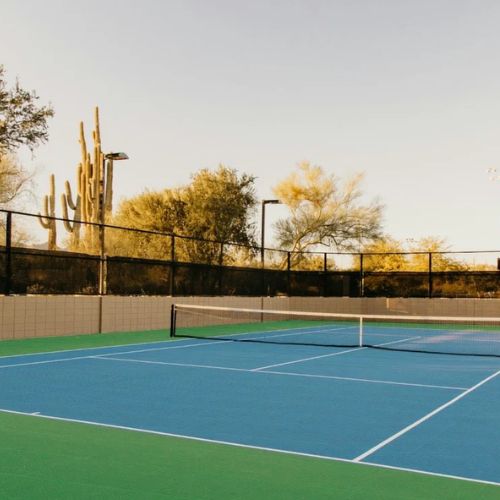 an image of a tennis court to visualize how big is 0.5 acres