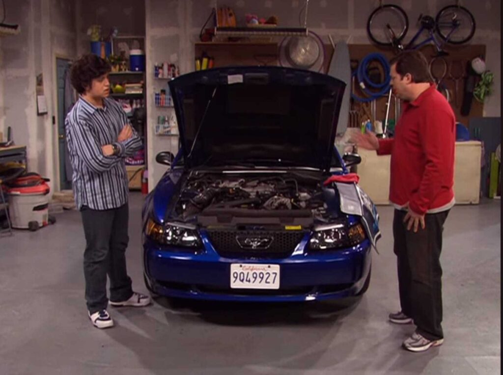 Josh is with his dad in his garage 