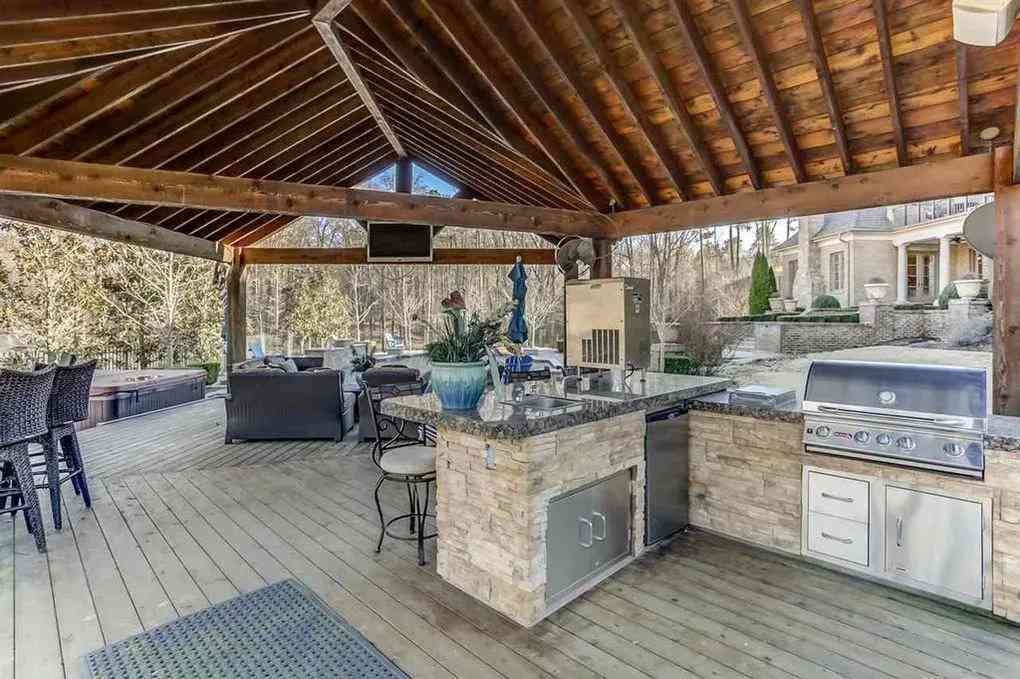 ja morants house outdoor kitchen with dining area